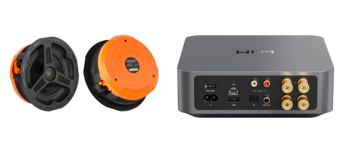 Monitor Audio uppokaiuttimet oranssilla tiivistekotelolla ja WiiM Amp verkkovahvistin liitäntöineen, säänkestävä kaiutinpaketti kattoon